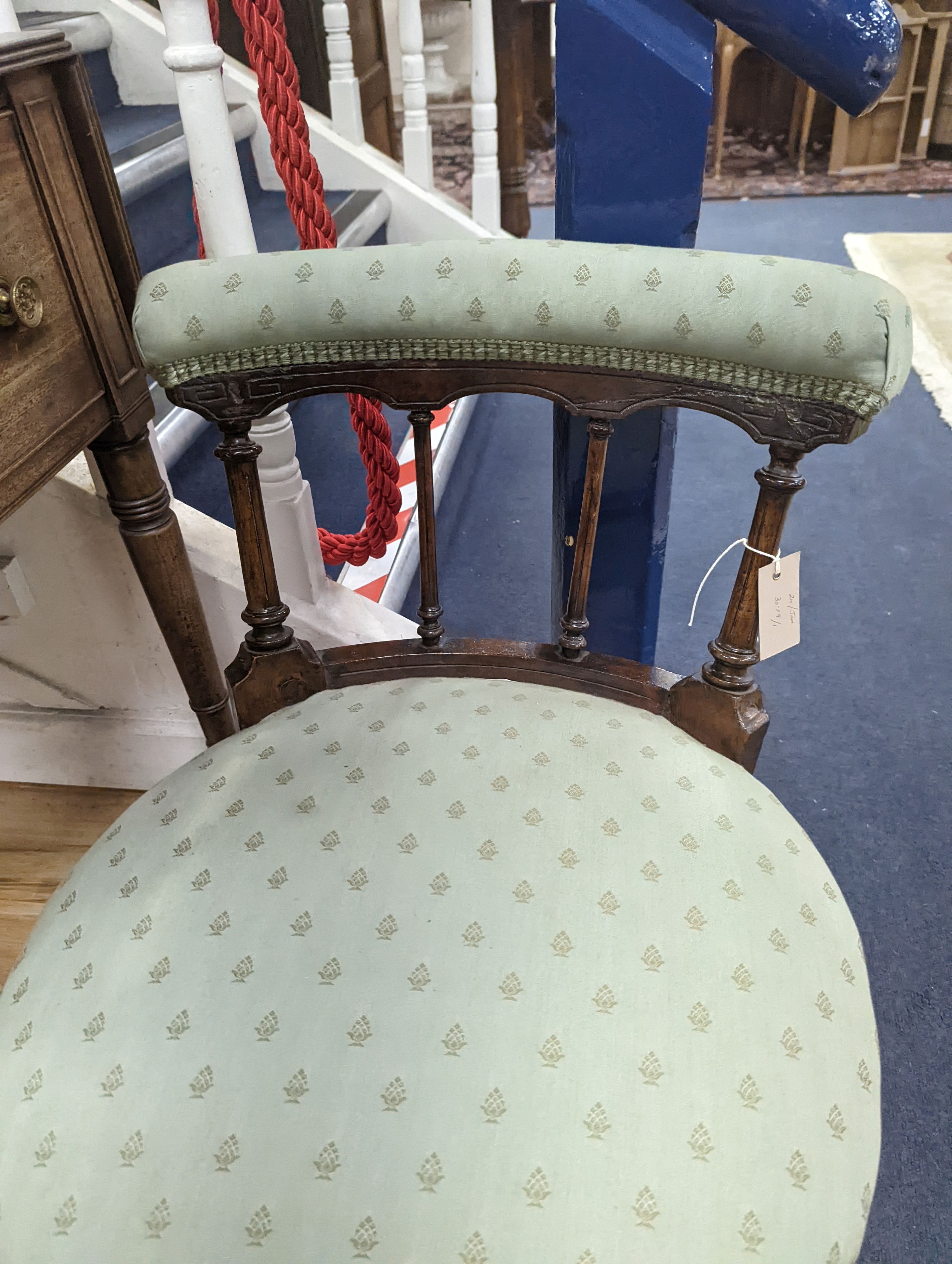 A Victorian walnut nursing chair. H-57cm.